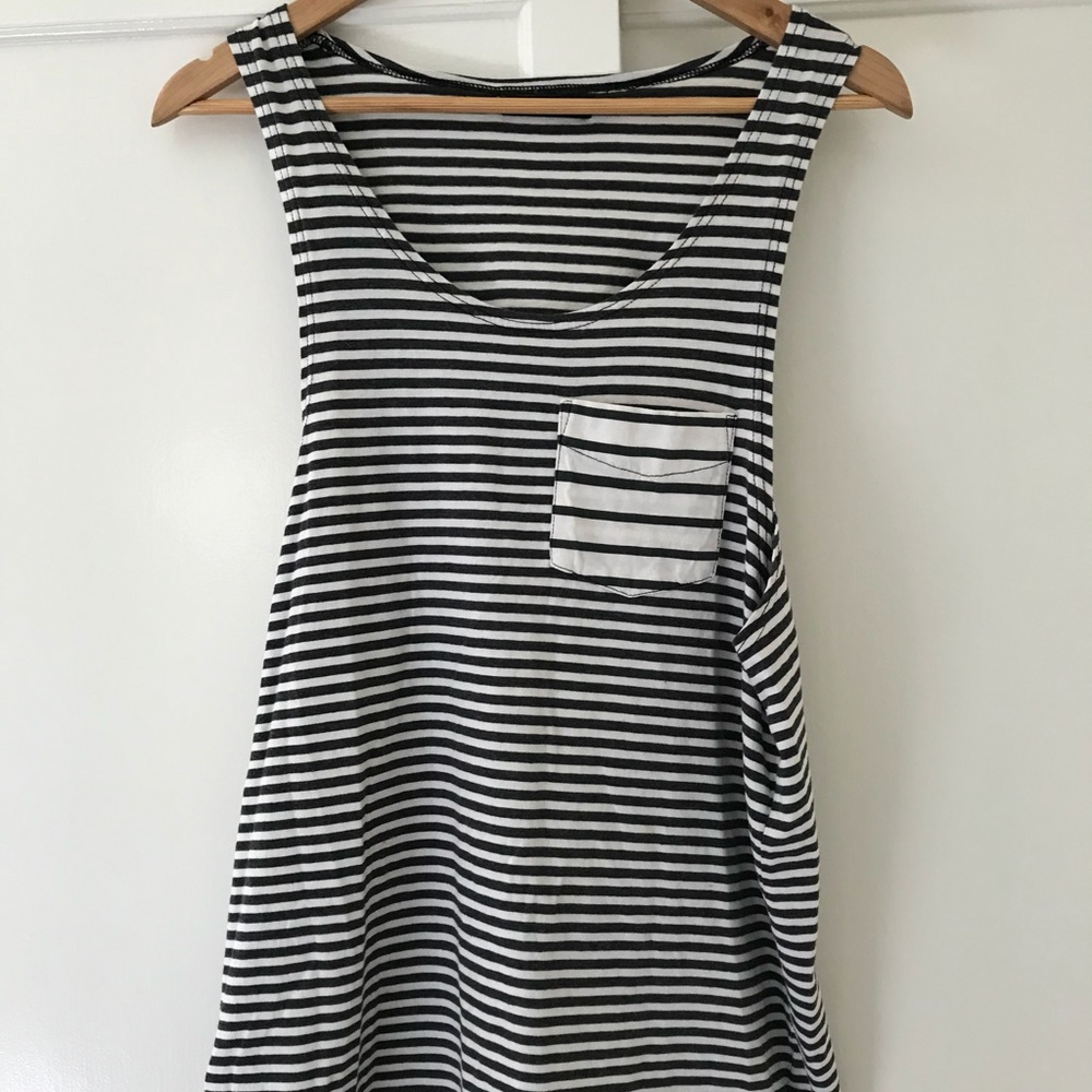 Lightly worn black and white striped pocket tank