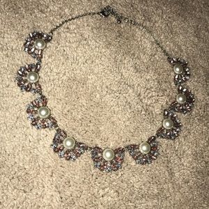 Short chain pearl jeweled necklace.