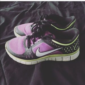 Purple and neon yellow Nike sneaker
