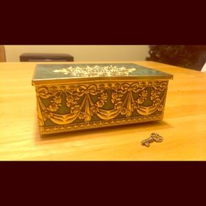 Vintage metal jewelry box with key