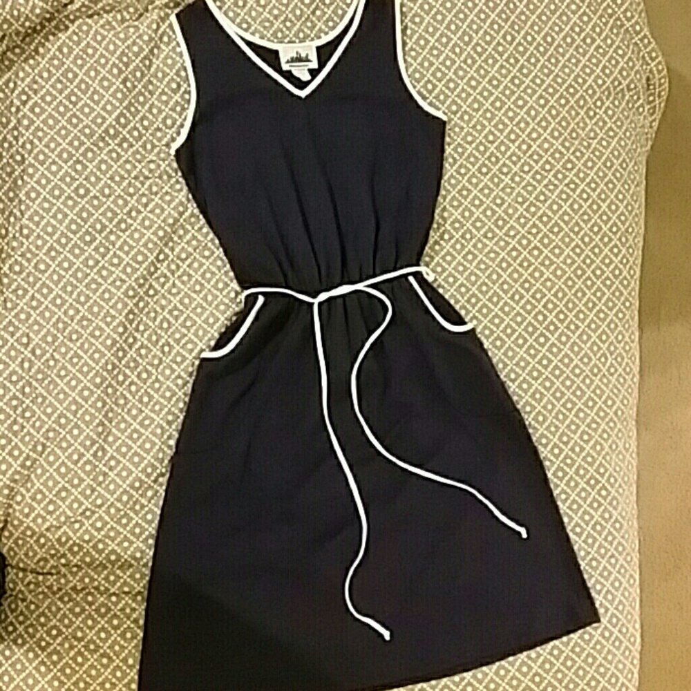 Navy dress with pockets and white piping detail