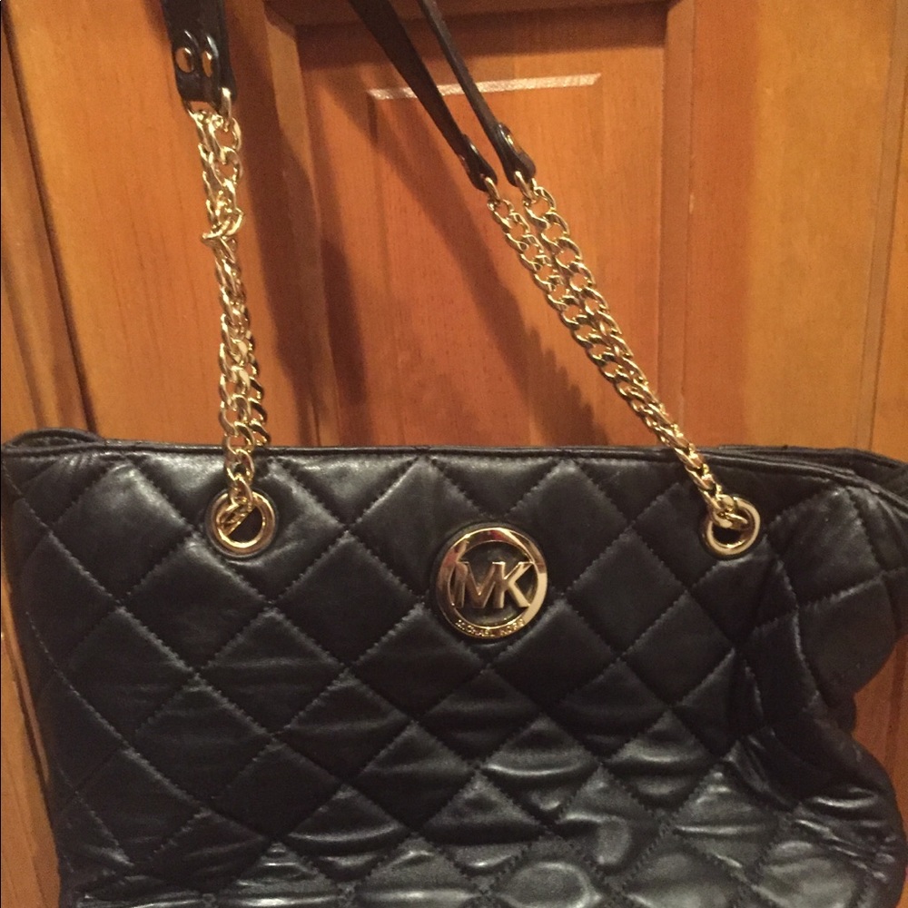 Michael Korrs black leather bag