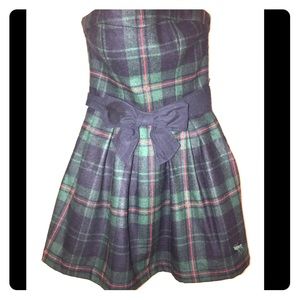 Strapless plaid mid length dress.