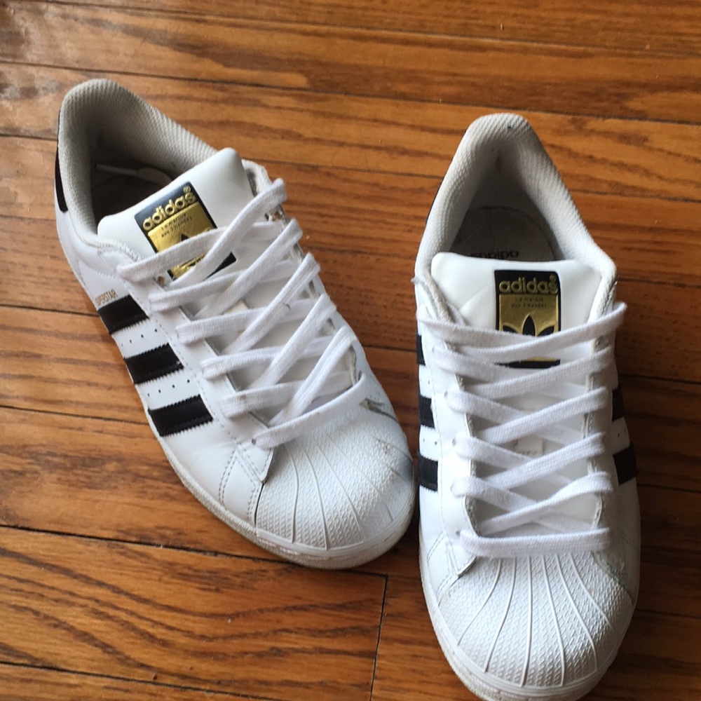 Black and white striped shell toe Adidas