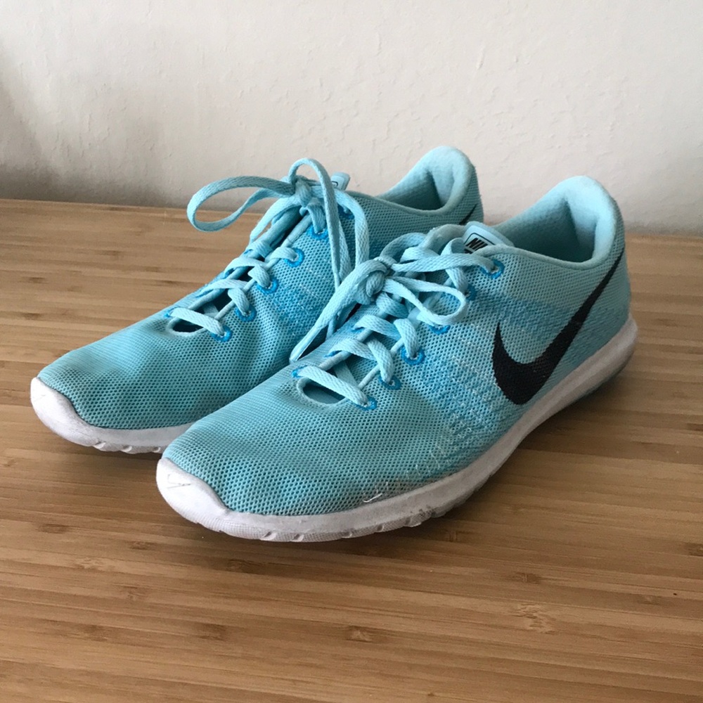 Light blue Nike running shoes