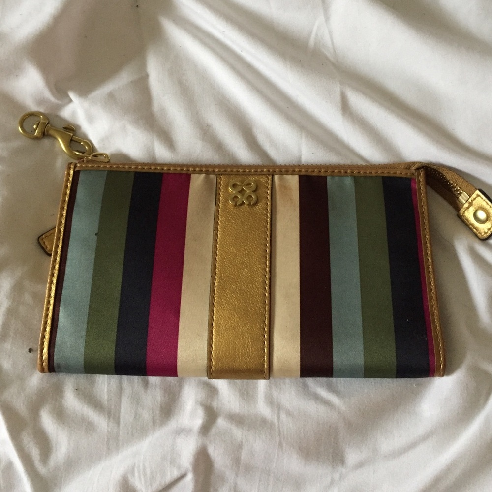 Gold trim striped Coach wristlet