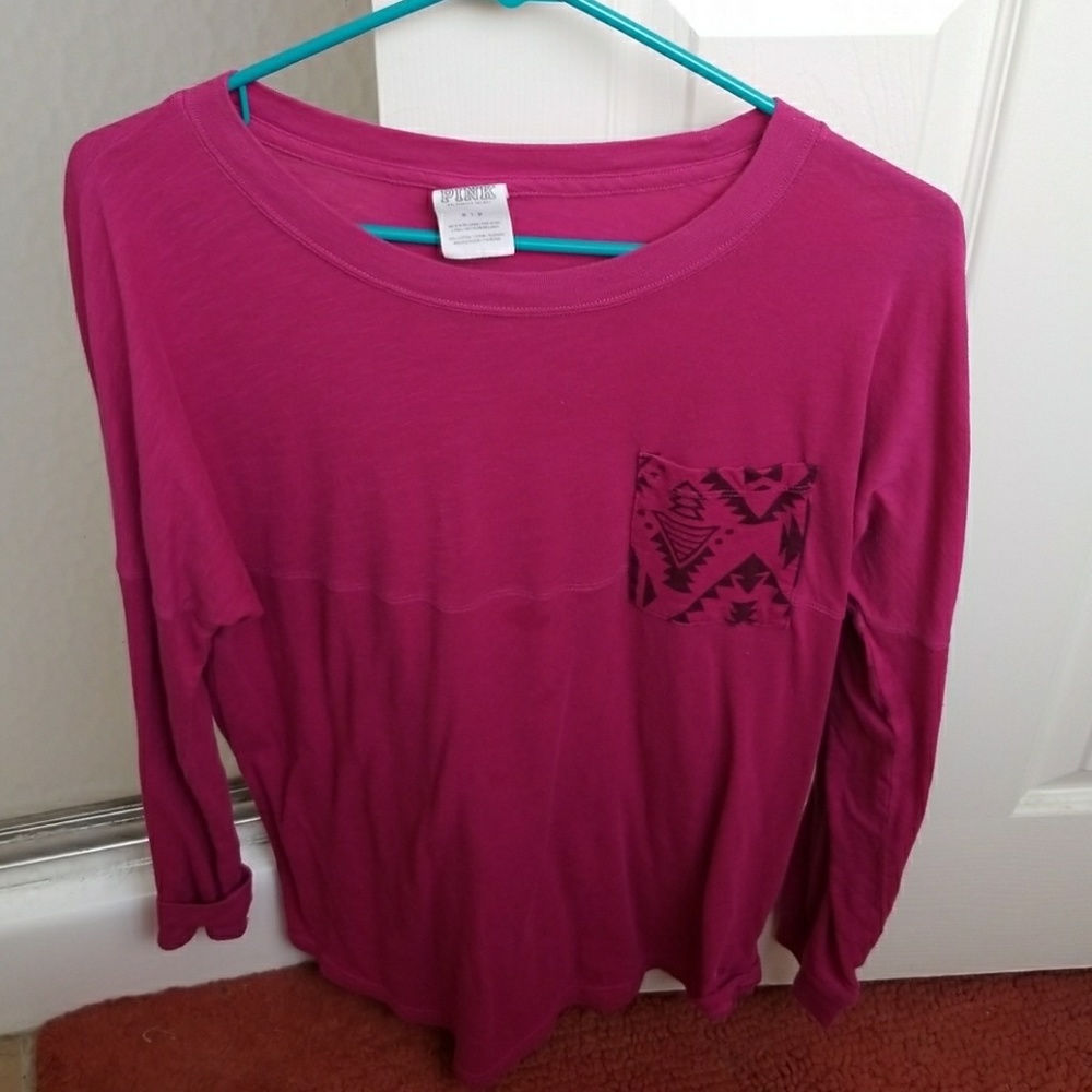 Pink long sleeved t-shirt.