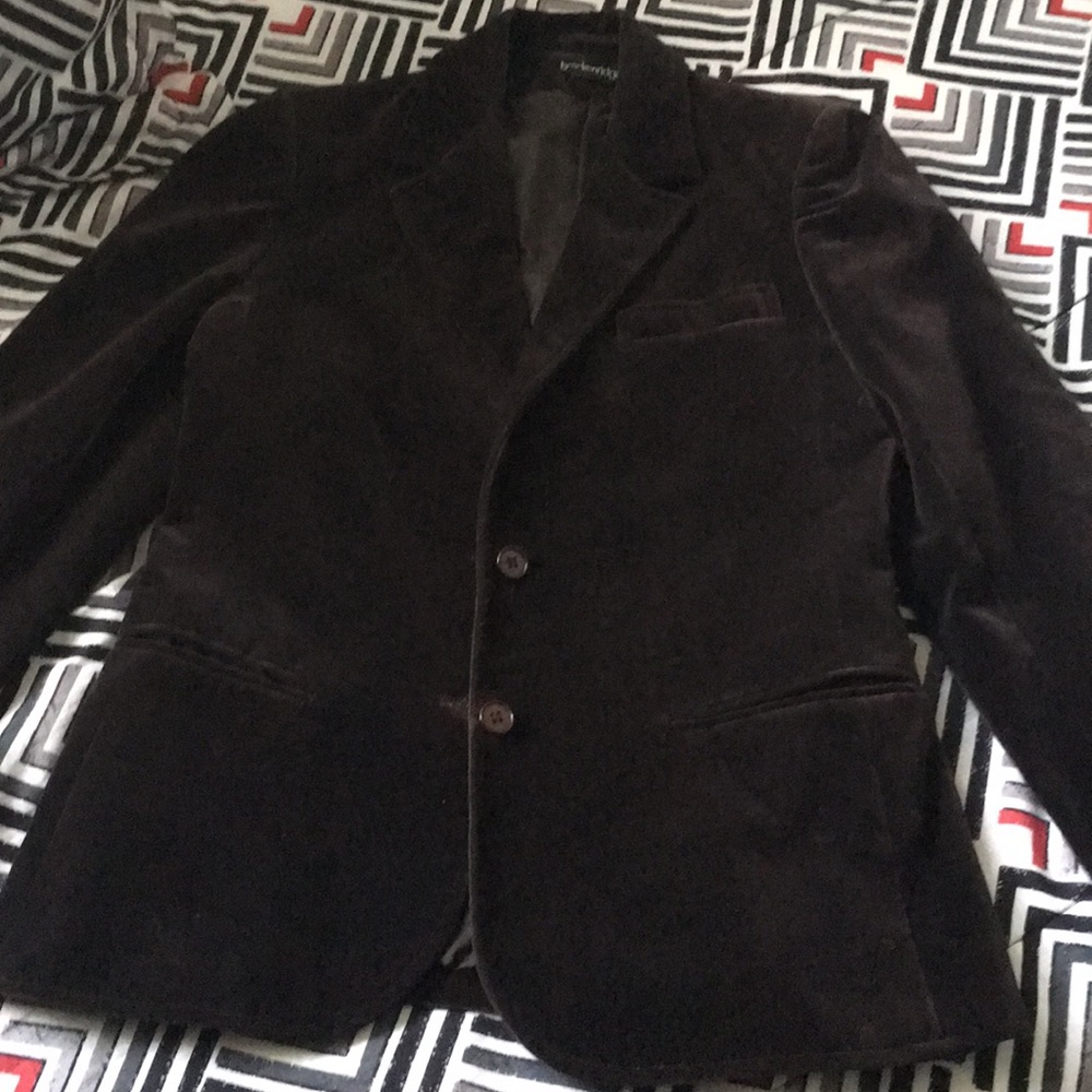 Dark brown velvet blazer has mark where button is