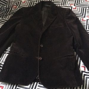 Dark brown velvet blazer has mark where button is