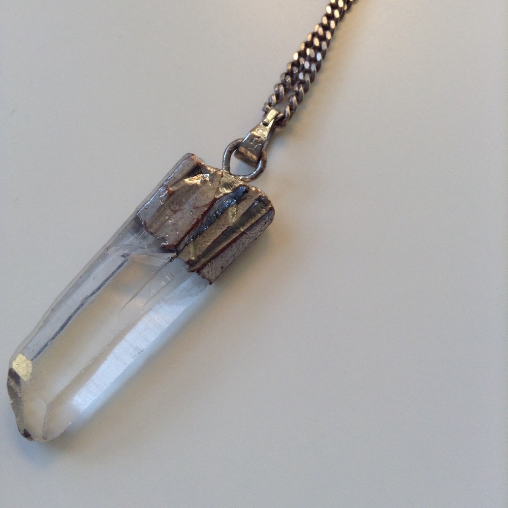Clear crystal pendant with silver accents