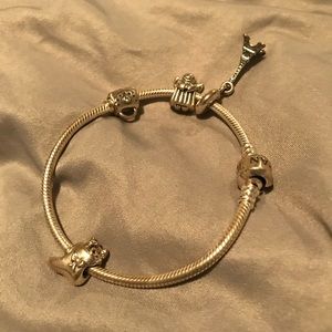Silver pandora bracelet with charms.