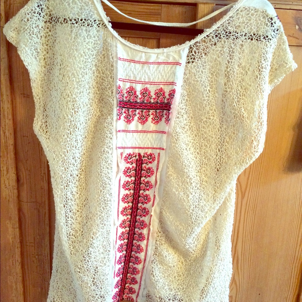 Free People long, loose-fitted, lace back top.