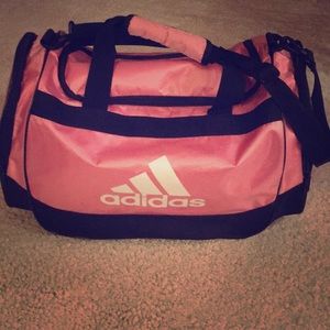 Pink and Black ADIDAS travel or gear bag.