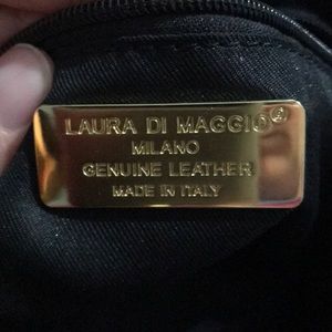 Black distressed leather purse. Crossbody option.