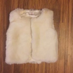 Infant fur vests.
