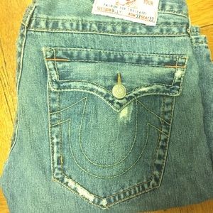 Men's TRUE RELIGION distressed jeans.