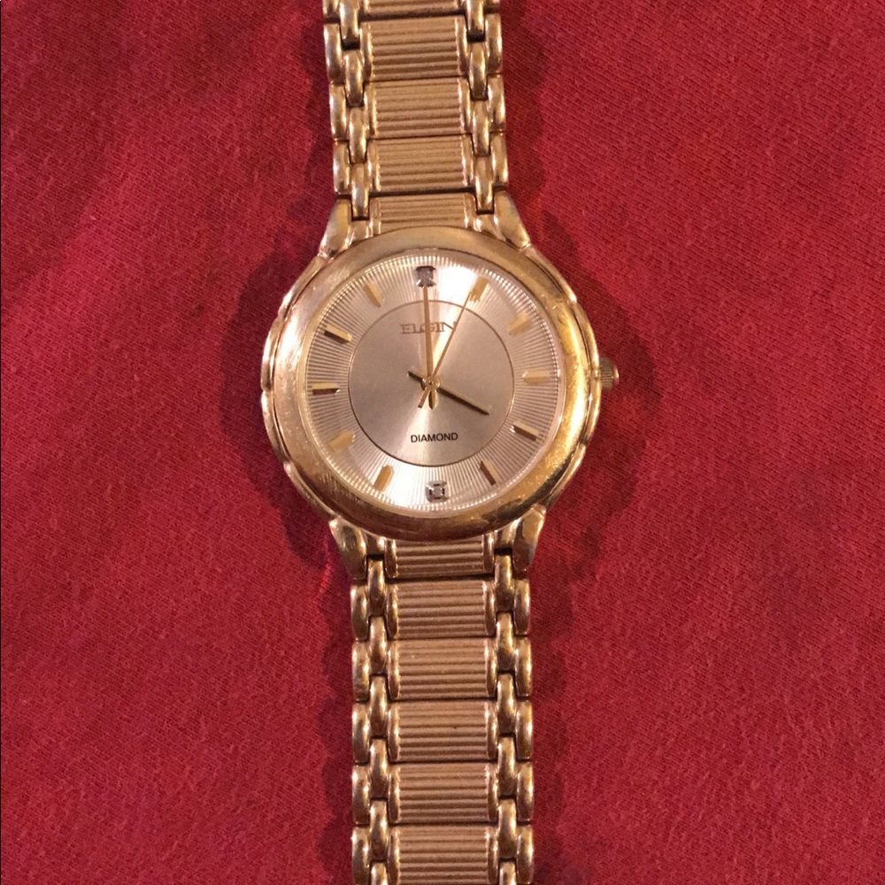 Men’s gold Elgin dress watch