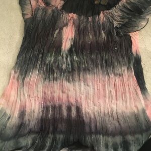 Fun and flowy medium shirt! Very comfortable on.