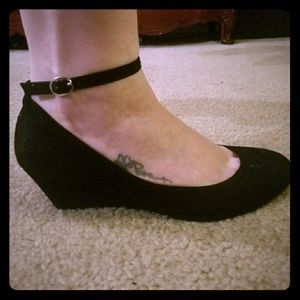 Black low wedges with an ankle strap. NWOT!