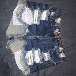 Blue denim shorts with rips