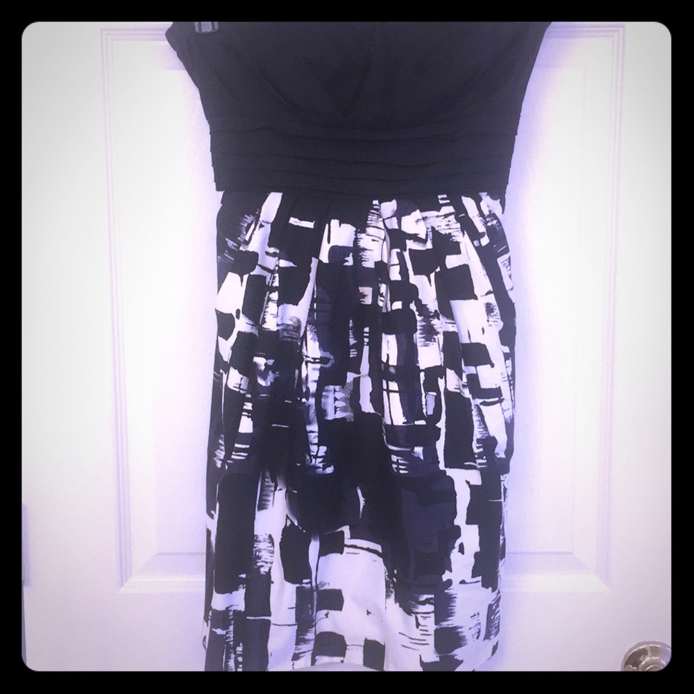 Adorable black tube mini dress with pockets