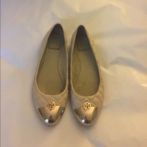 Tory Burch nude quilted flats with gold cap toes