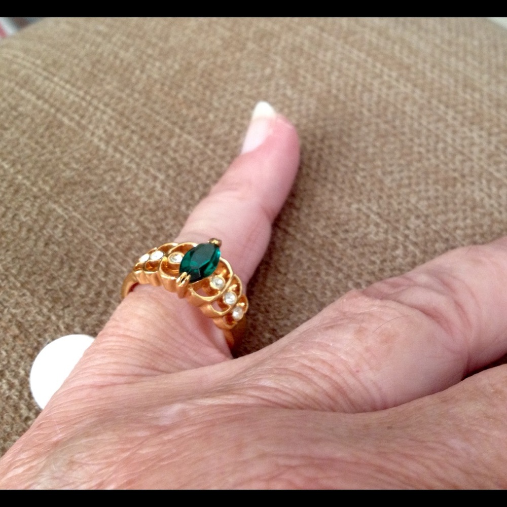 Emerald set with 6 cz baguettes in gold plate.