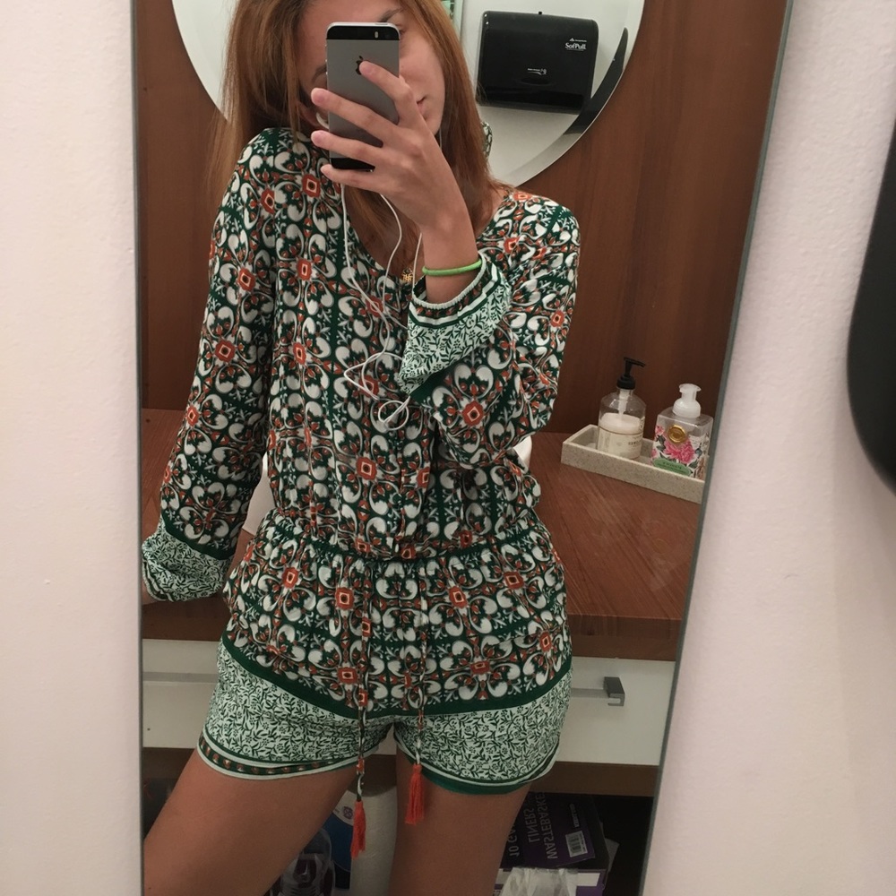 Green me orange long sleeve romper with tassels