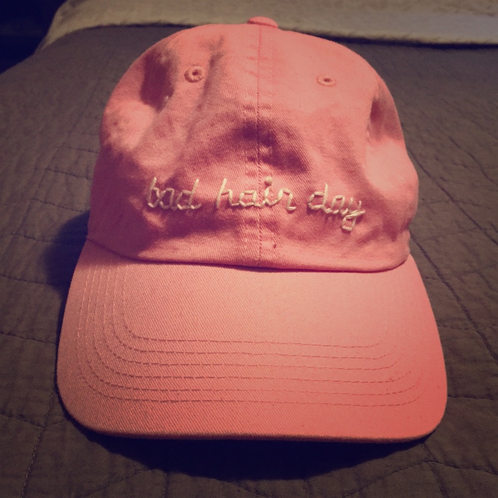 Pink baseball cap with phrase “bad hair day”