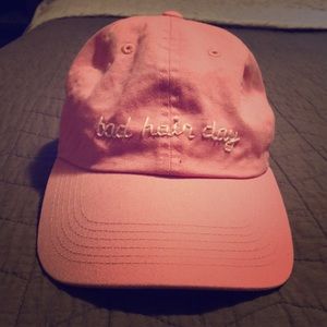 Pink baseball cap with phrase “bad hair day”