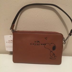 Snoopy coach wristlet, brand new