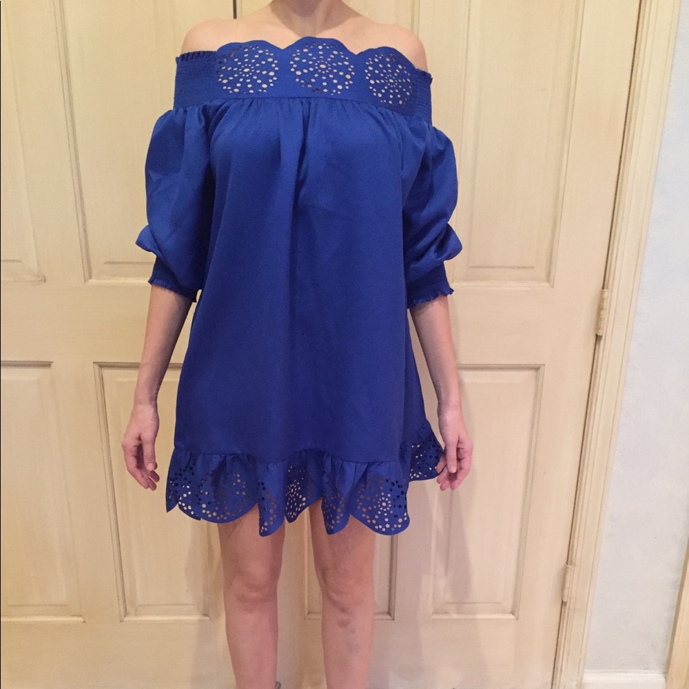Blue off the shoulder dress.