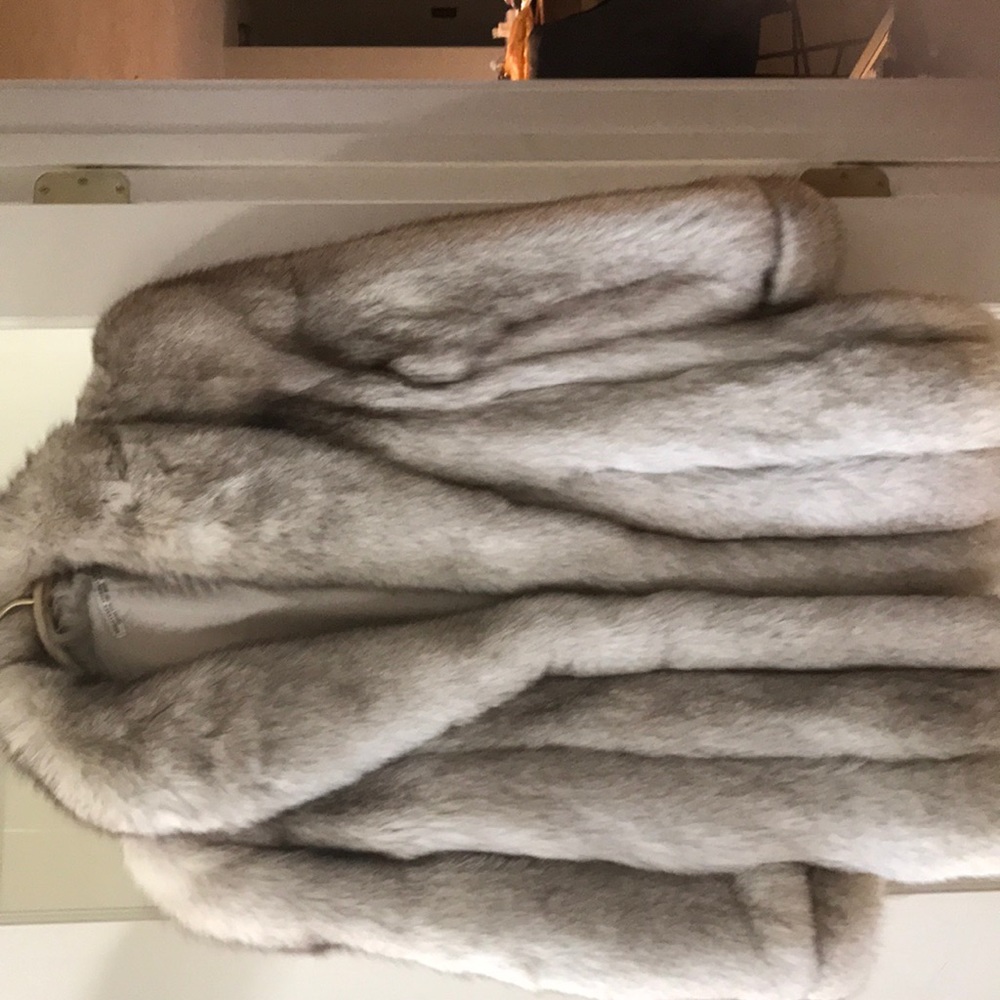 A quarter length fox fur coat .