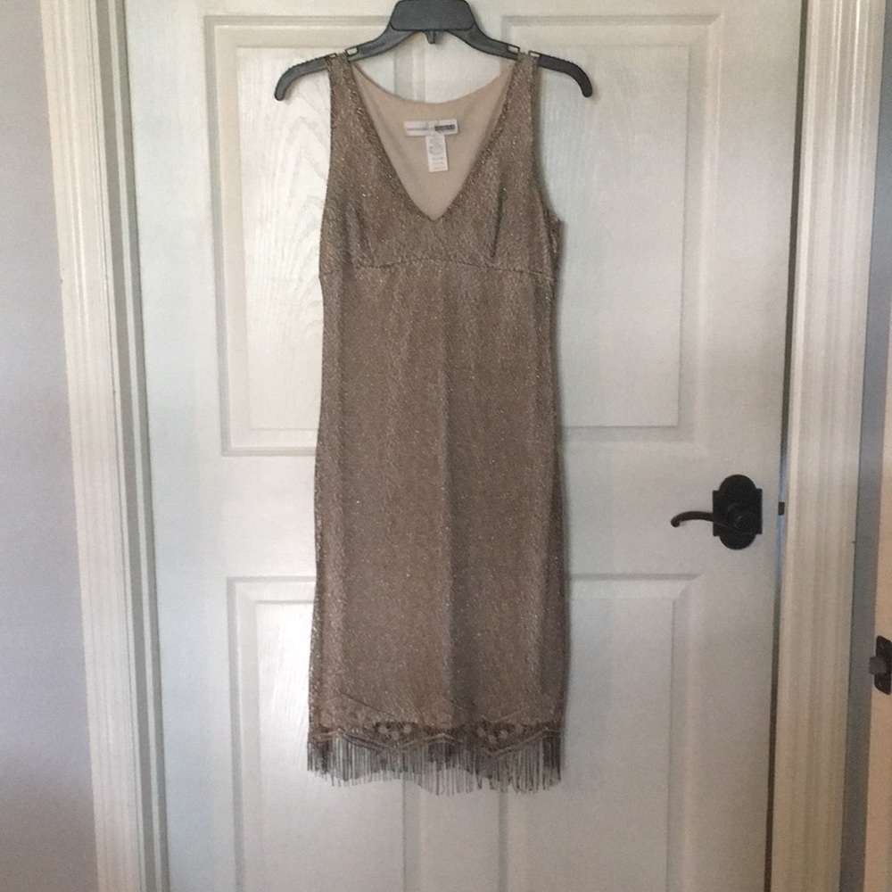 Gold party dress with a lot of stretch in it.