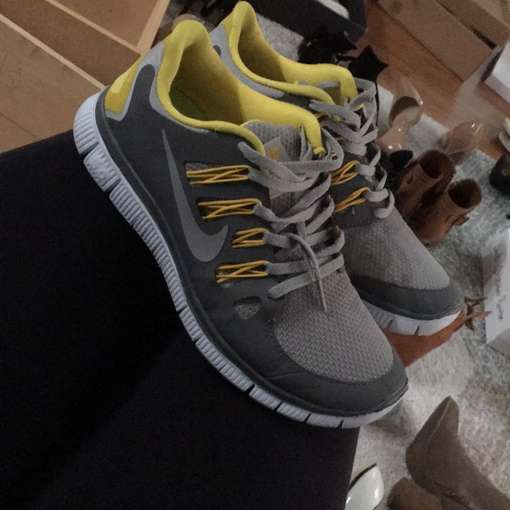 Grey and yellow Nikes