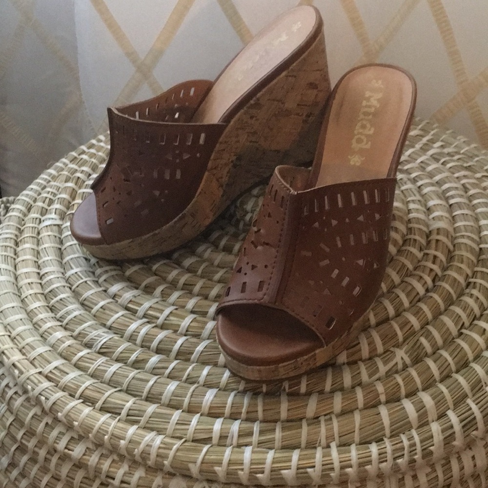 Open toe brown high cork wedge shoes.