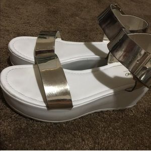 White platforms with metallic straps