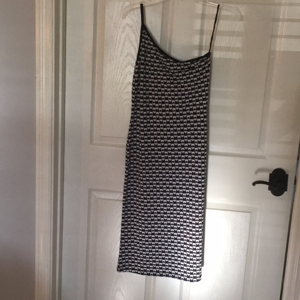 Black and white 3/4 length tight fitting dress.