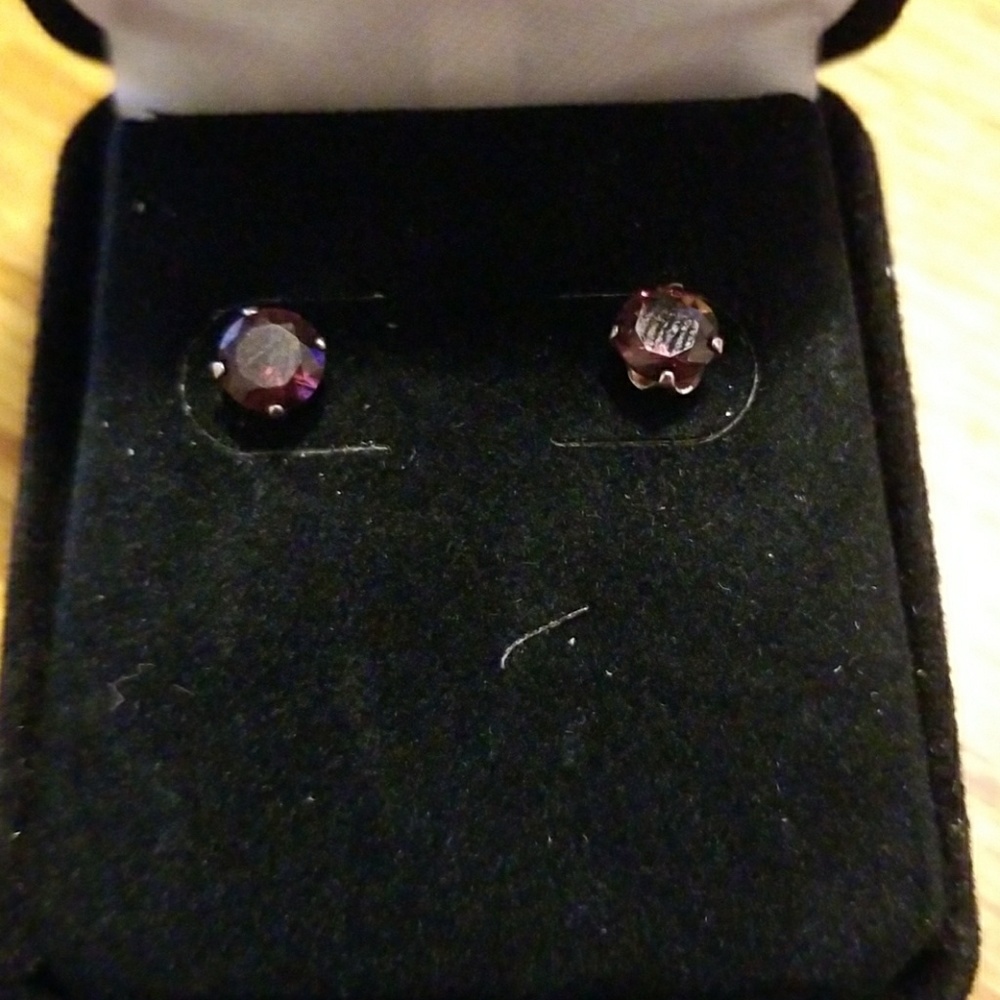 Amethyst stud earrings set in 18 kt white gold
