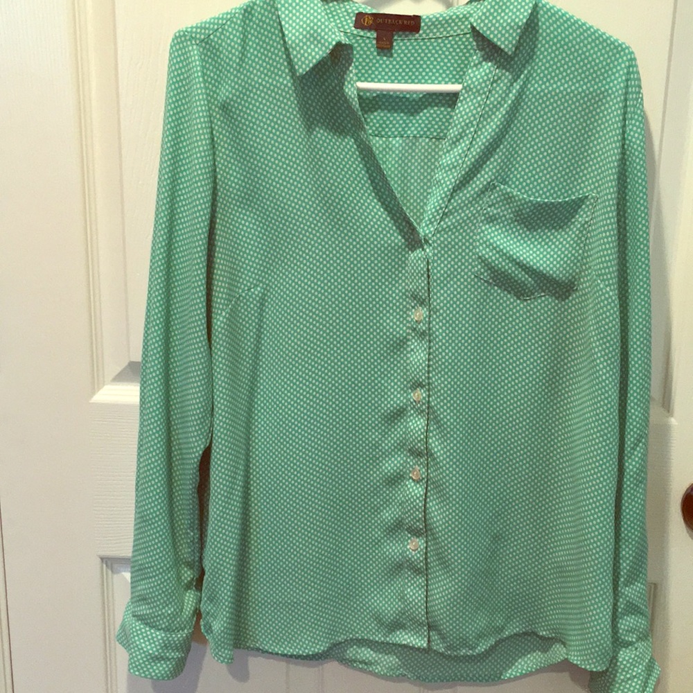 Green and white polka dot blouse