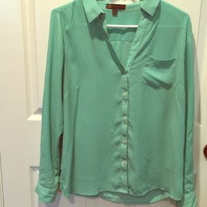 Green and white polka dot blouse