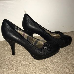 Black buckle pumps