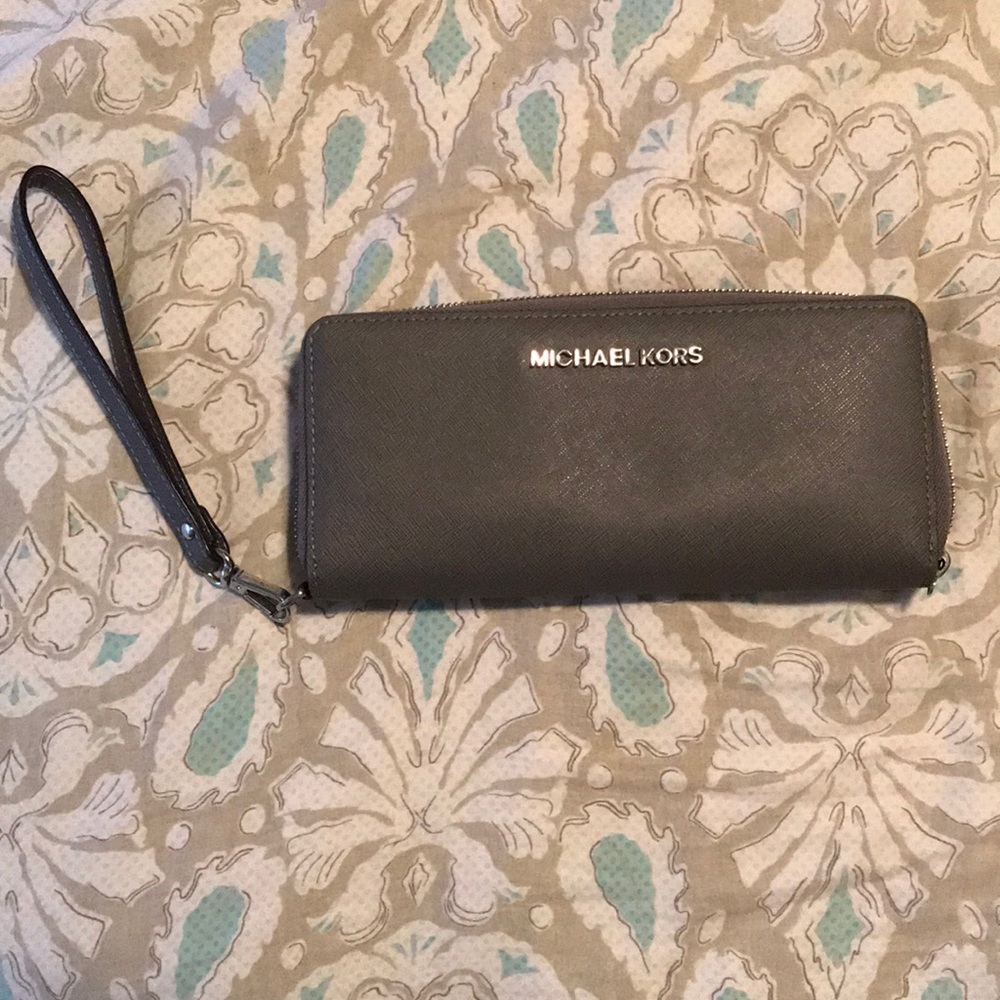 Michael Kors wrist bag or clutch.
