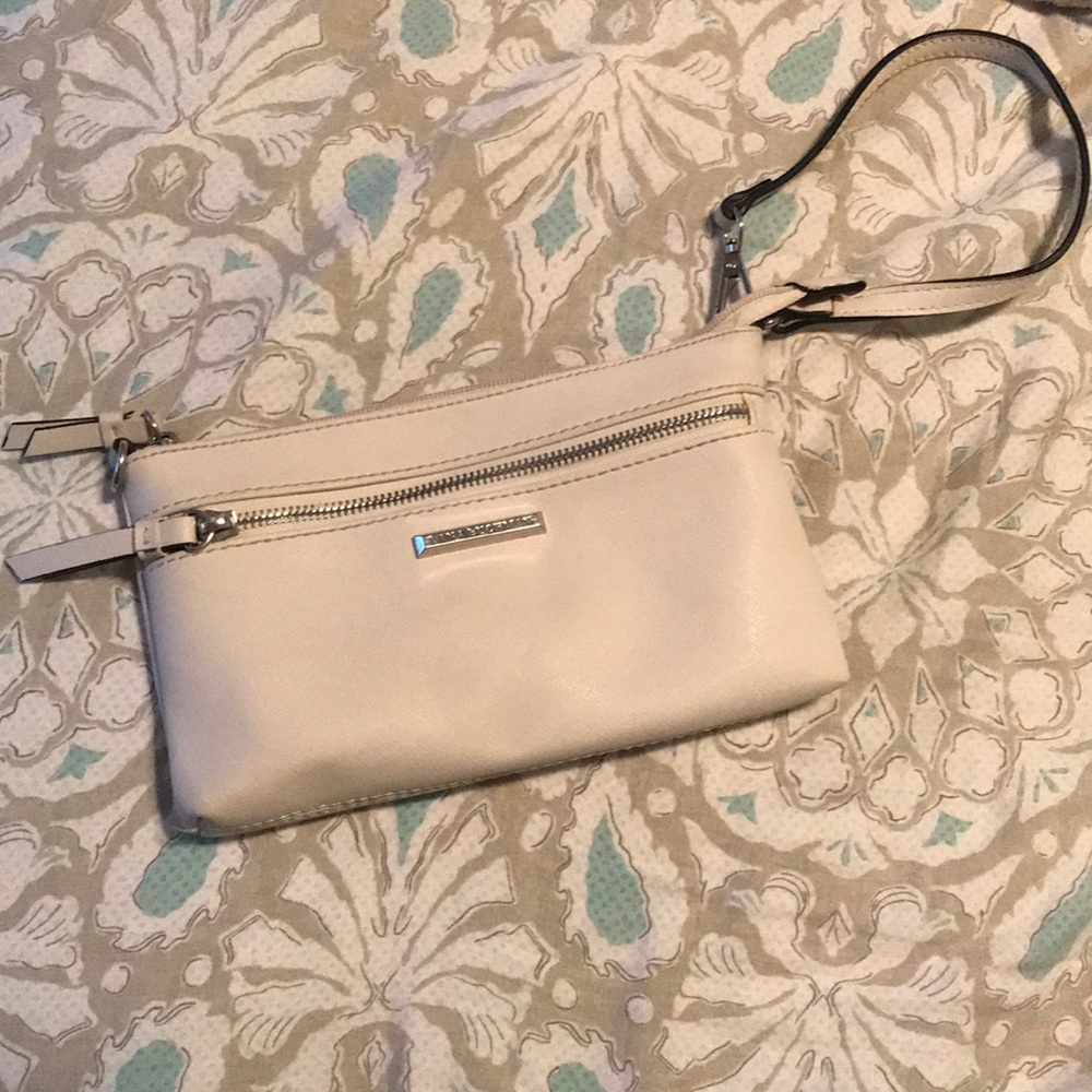 Cream clutch or wristlet.