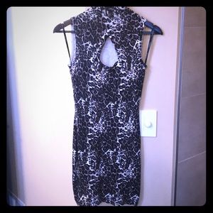 Very sexy BEBE knit dress w/mock neck & key hole