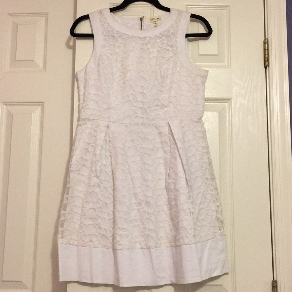 white dress, embroidered circles & slimming cut in