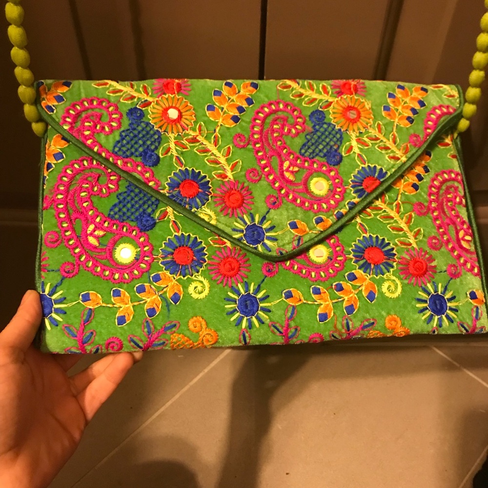 Green embroidered clutch bag