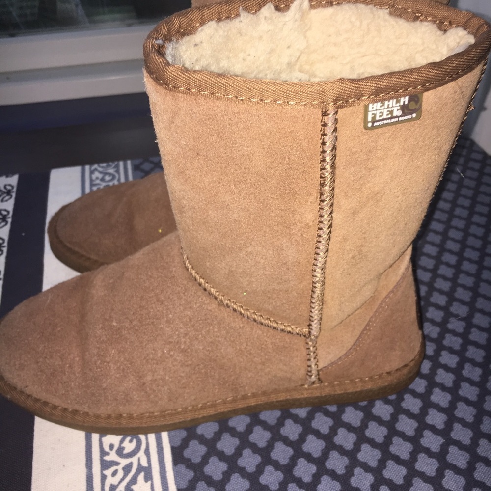 Ugg boots by beach feet