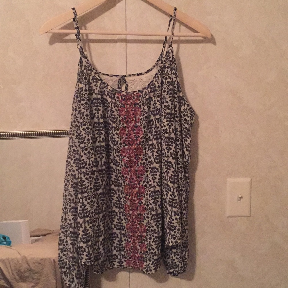 Long sleeve shirt with shoulder cut outs.