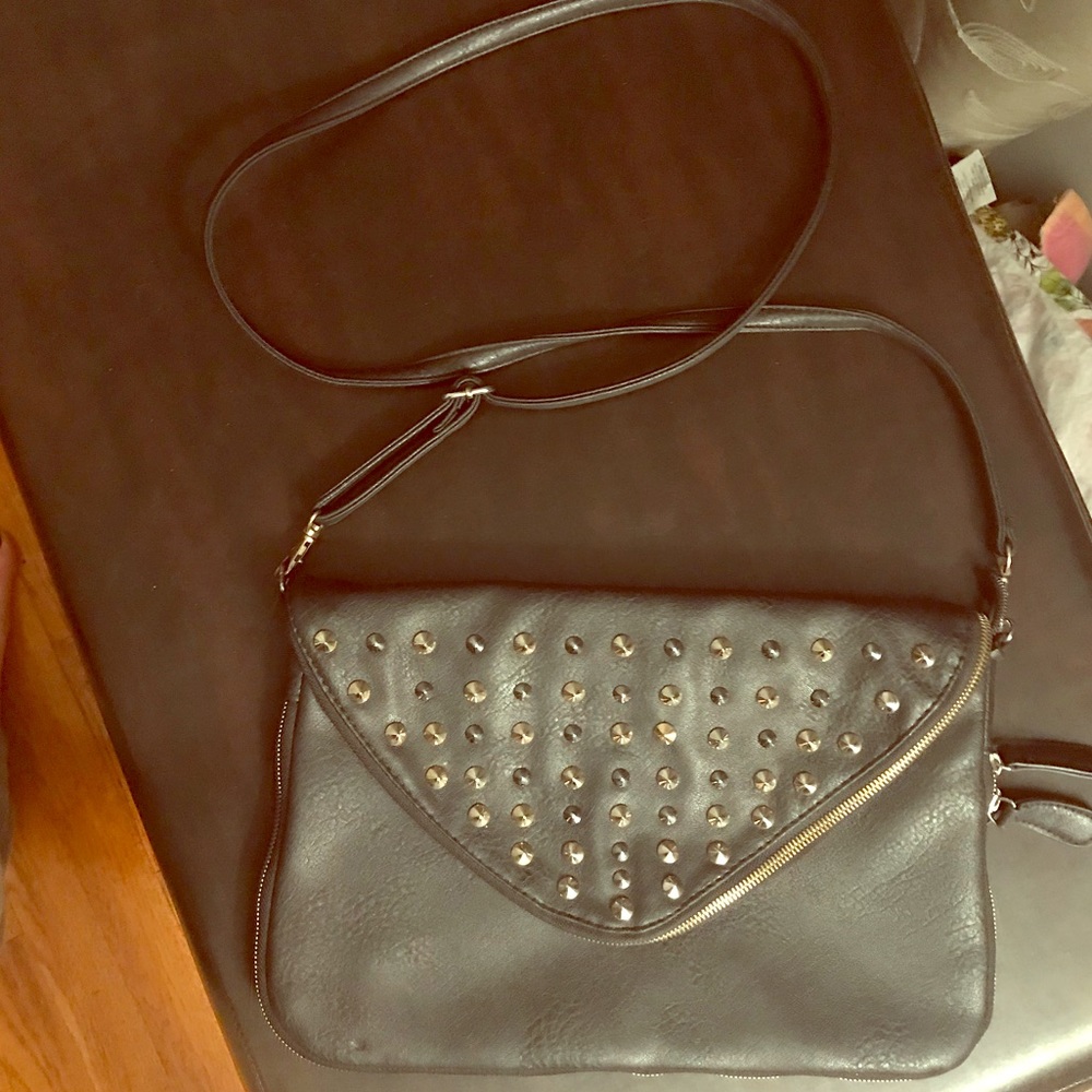 Black shoulder bag. Silver and gold studding.